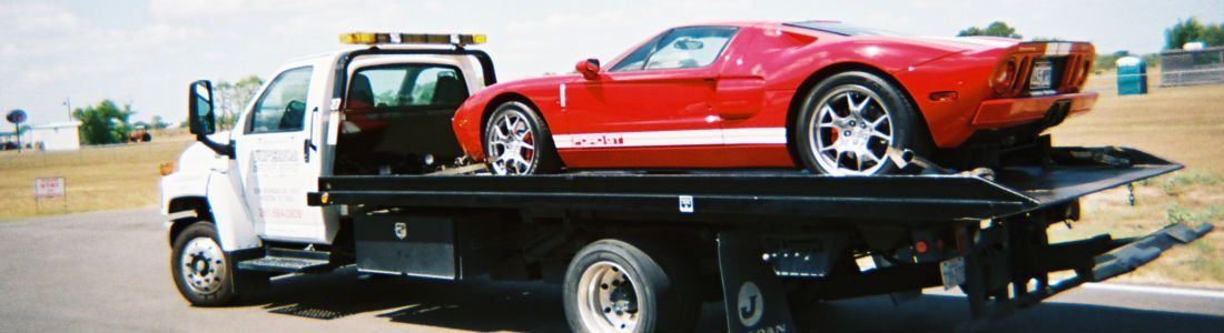 Sports car on a flatbed tow truck