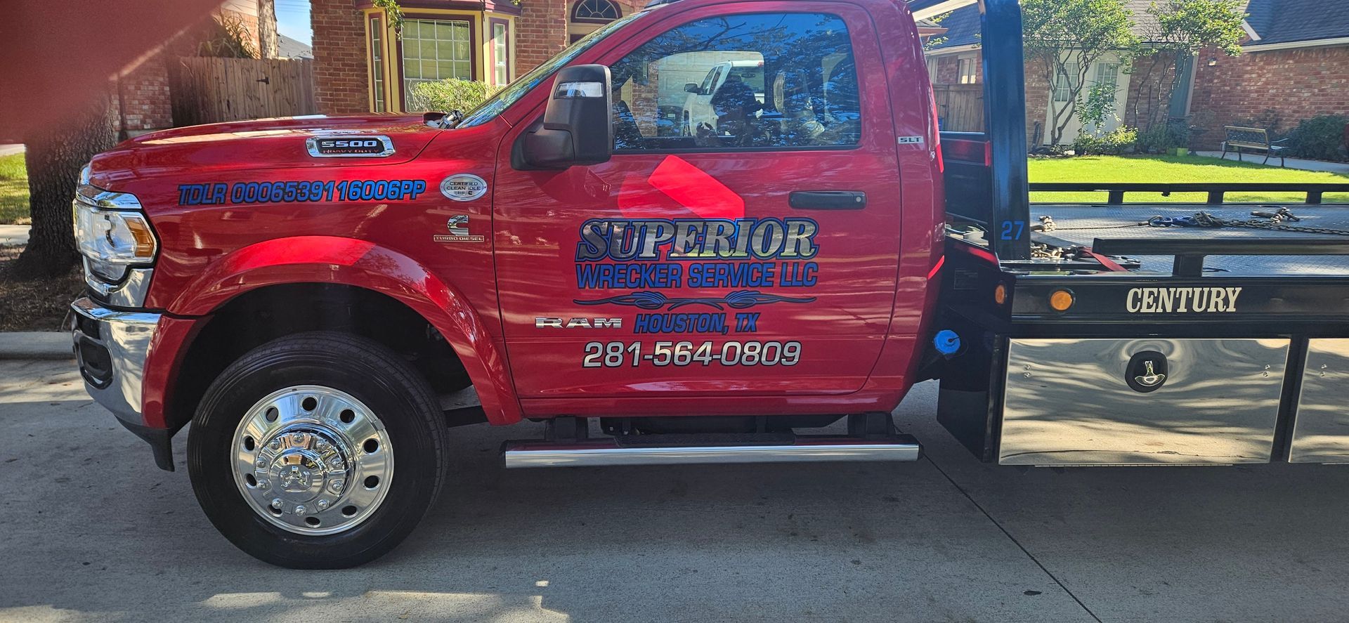Red tow truck parked on a residential street