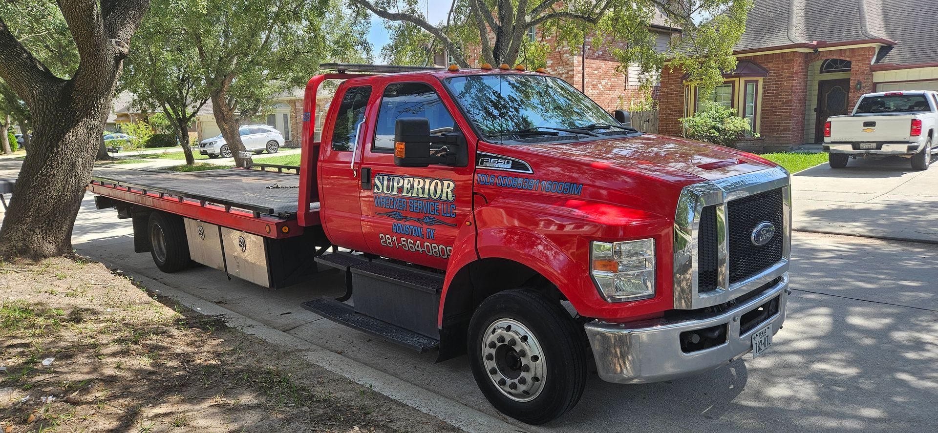 Red tow truck on a residential street