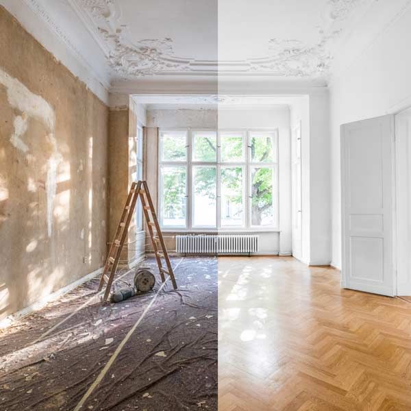 Before and after home renovation: The renovated room. The Left side shows demolition with a brown wall. The right side is finished, featuring white walls and wood floors.