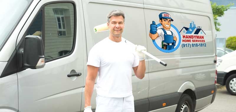 A painter in white holding a paint roller in front of a van with a logo Home Improvements Long Island - Honest Hammer