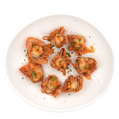 Fried wontons on a white plate, garnished with parsley.