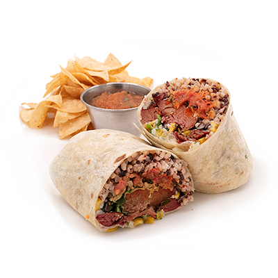 Burrito cut in half, with chips and salsa on a white background.