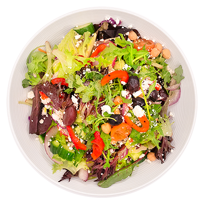 Greek salad in a white bowl with lettuce, olives, feta cheese, red peppers, and chickpeas.