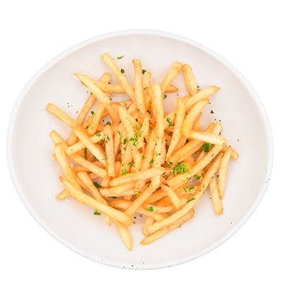 French fries in a white bowl, lightly seasoned with herbs.