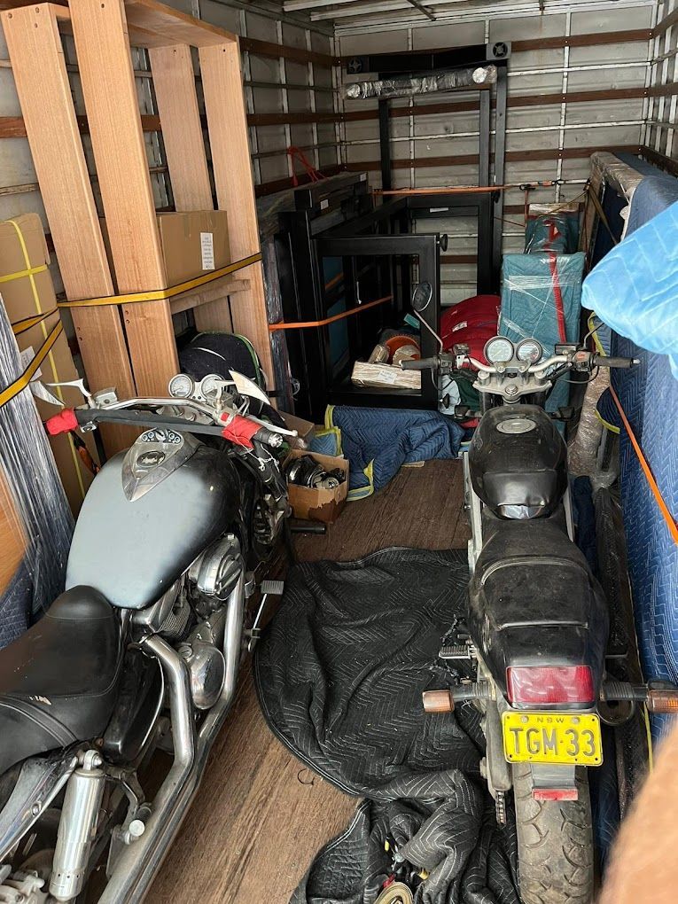 Two Motorcycles Are Parked Inside of a Moving Truck — Ready To Move in Mullumbimby, NSW