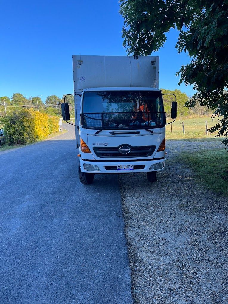 A White Truck is Parked on the Side of the Road — Ready To Move in Mullumbimby, NSW
