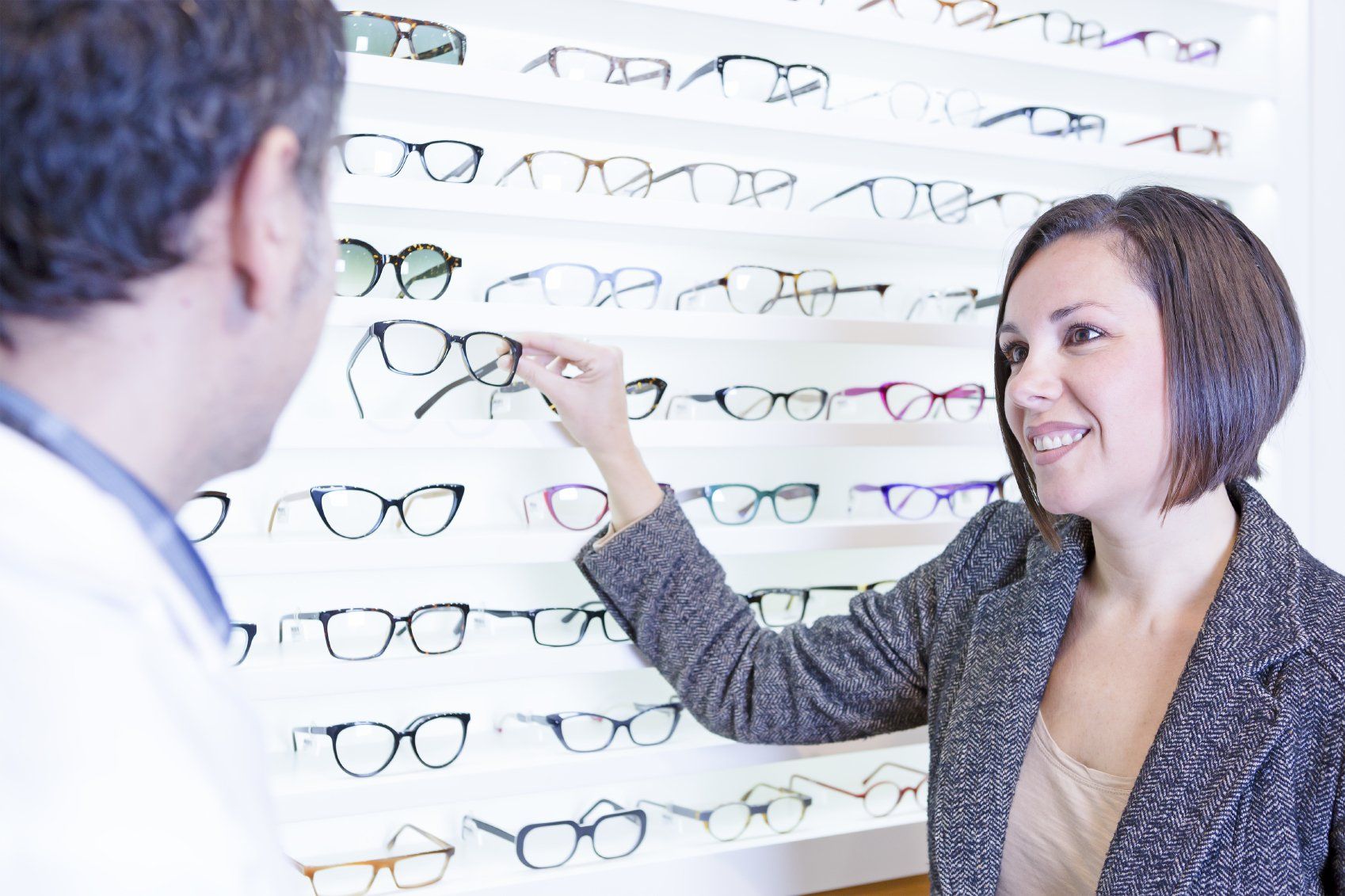 Woman Browsing Selection of Prescription Eyeglasses
