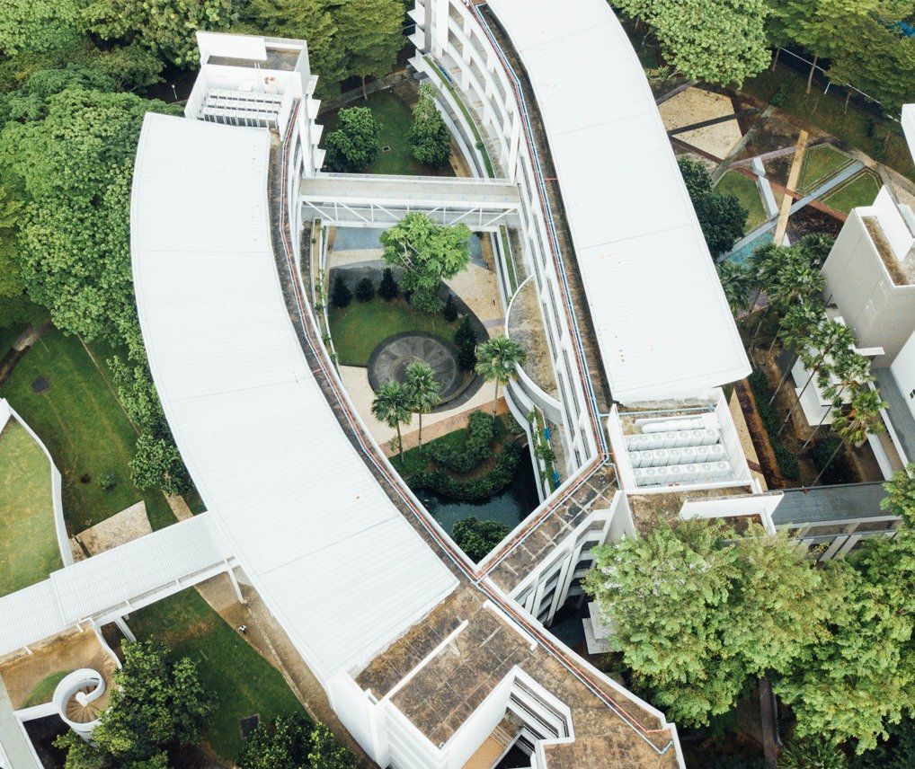 aerial view of a green landscape and building