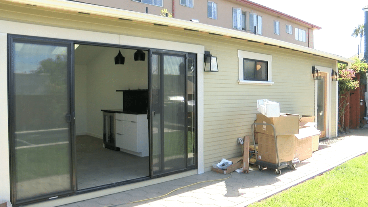 exterior of house looking in sliding glass doors