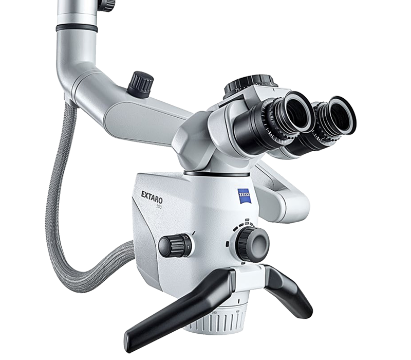 A dental microscope with a hose attached to it