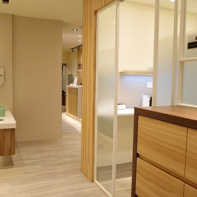 A hallway with a sliding glass door leading to a bathroom.