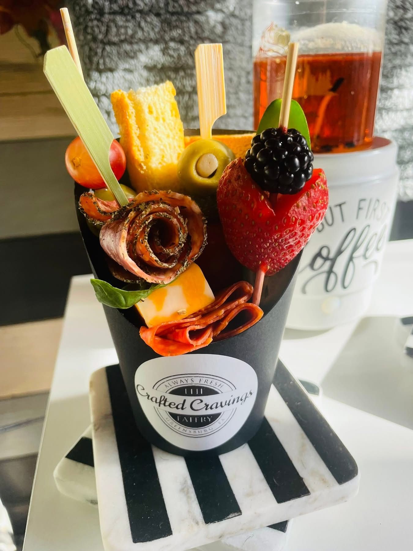 Submarine sandwich filled with colorful slaw on a white plate.