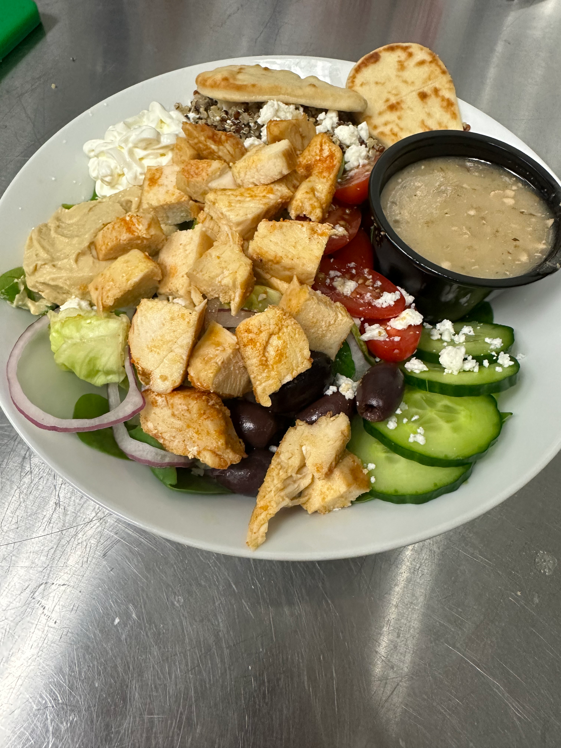 Grilled cheese sandwich being pulled apart, showcasing melted cheese.