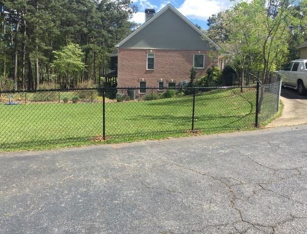 A home with a fence put up by a fence company serving Athens, GA