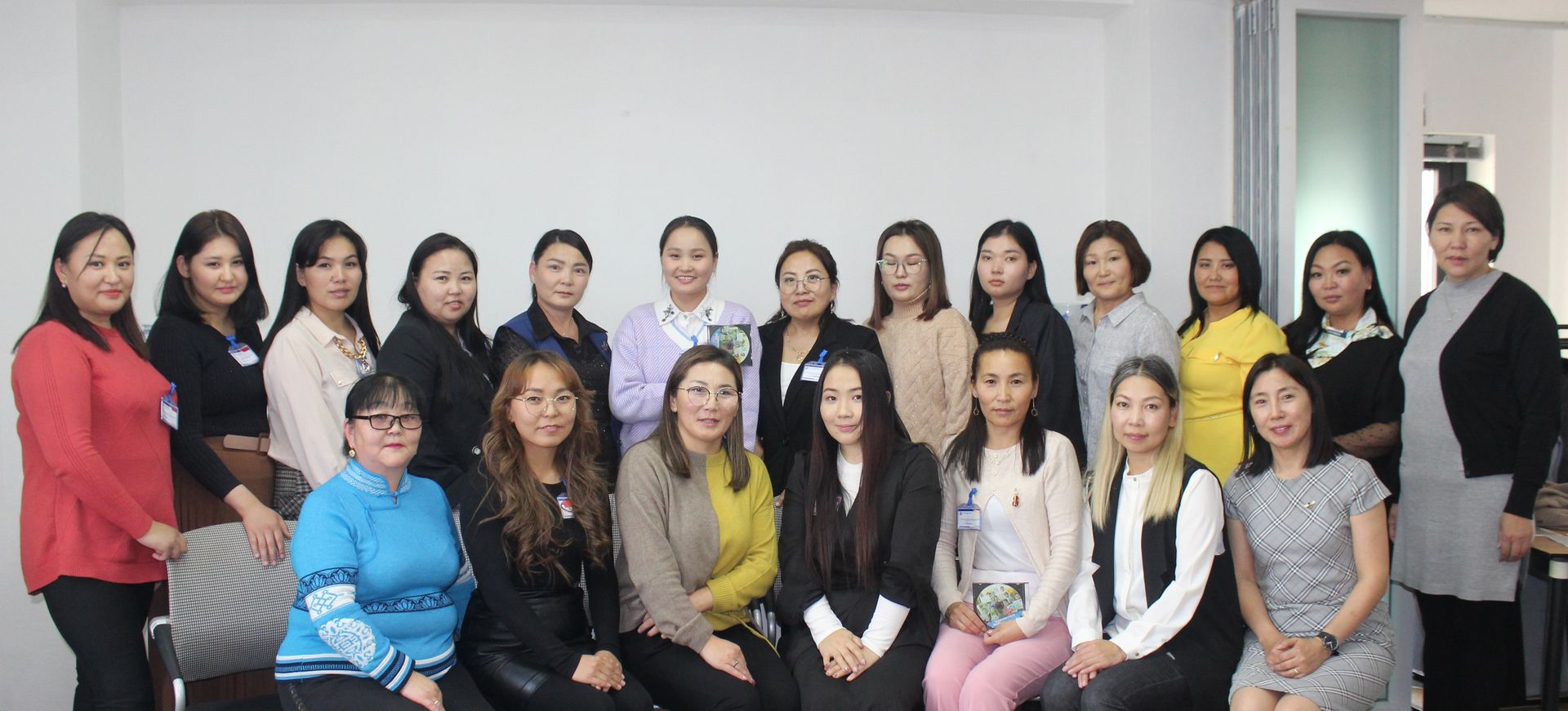 A group shot of MDC teachers, all women, ready to participate in their training. 