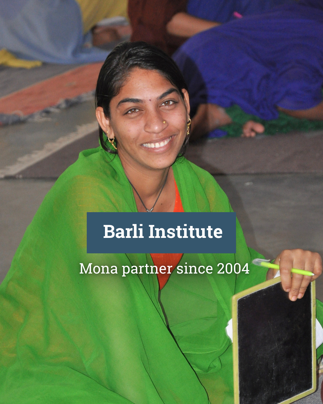 A group of women are walking down a street holding signs in their hands.