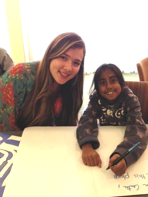 A Mona volunteer tutoring a student from one of our partner programs. 