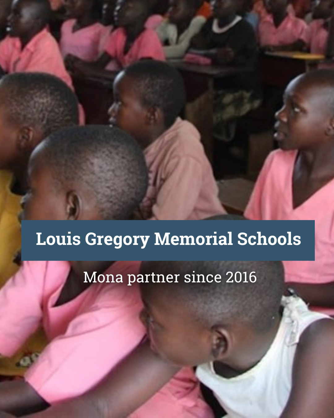 A group of children are posing for a picture in front of a building