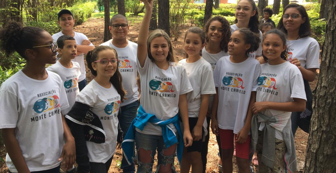 A small group of students outdoors in their Mount Carmel t-shirts. 