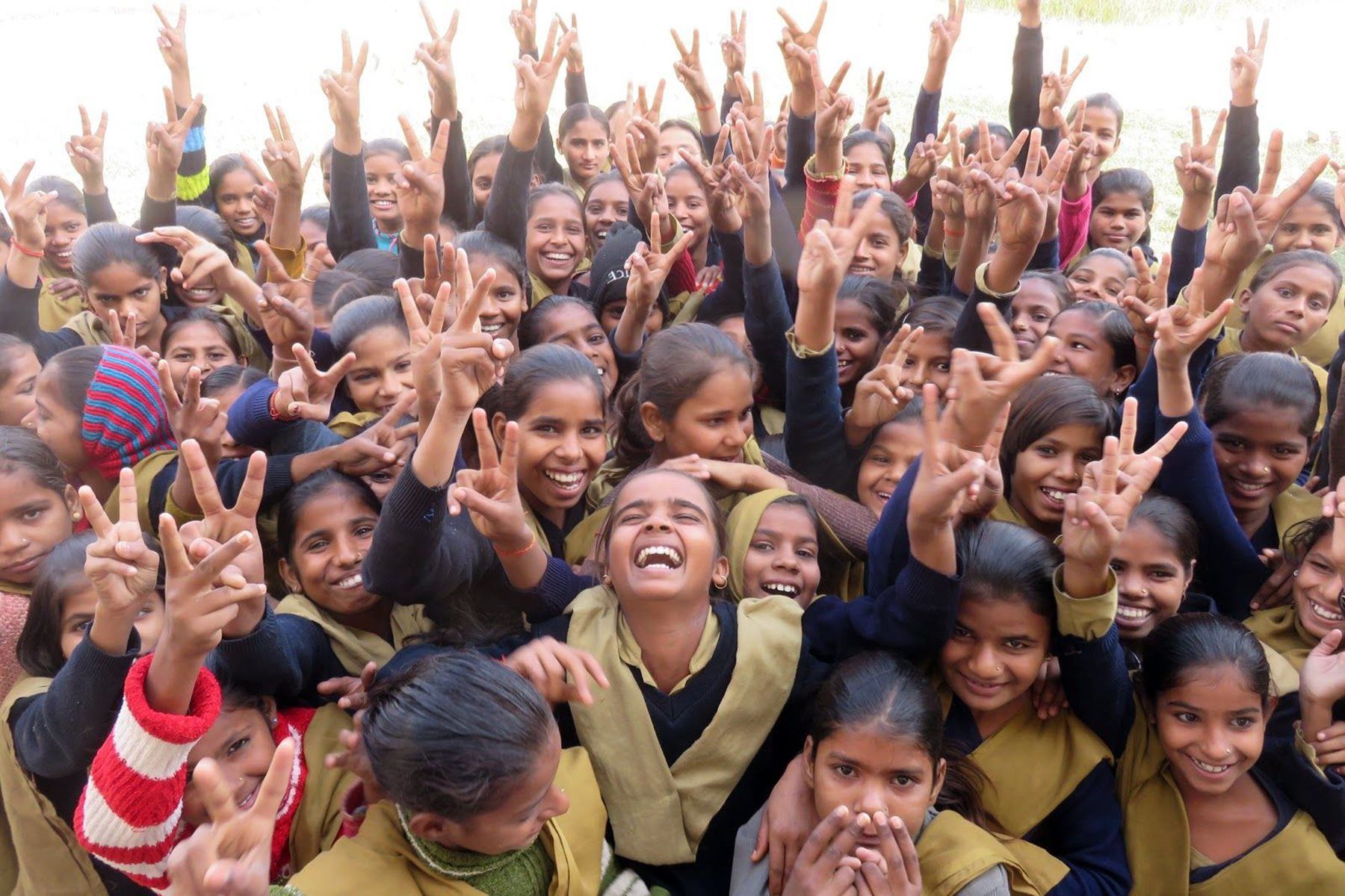 A large group of young girl students from Study Hall Educational Foundation, smiling together. 