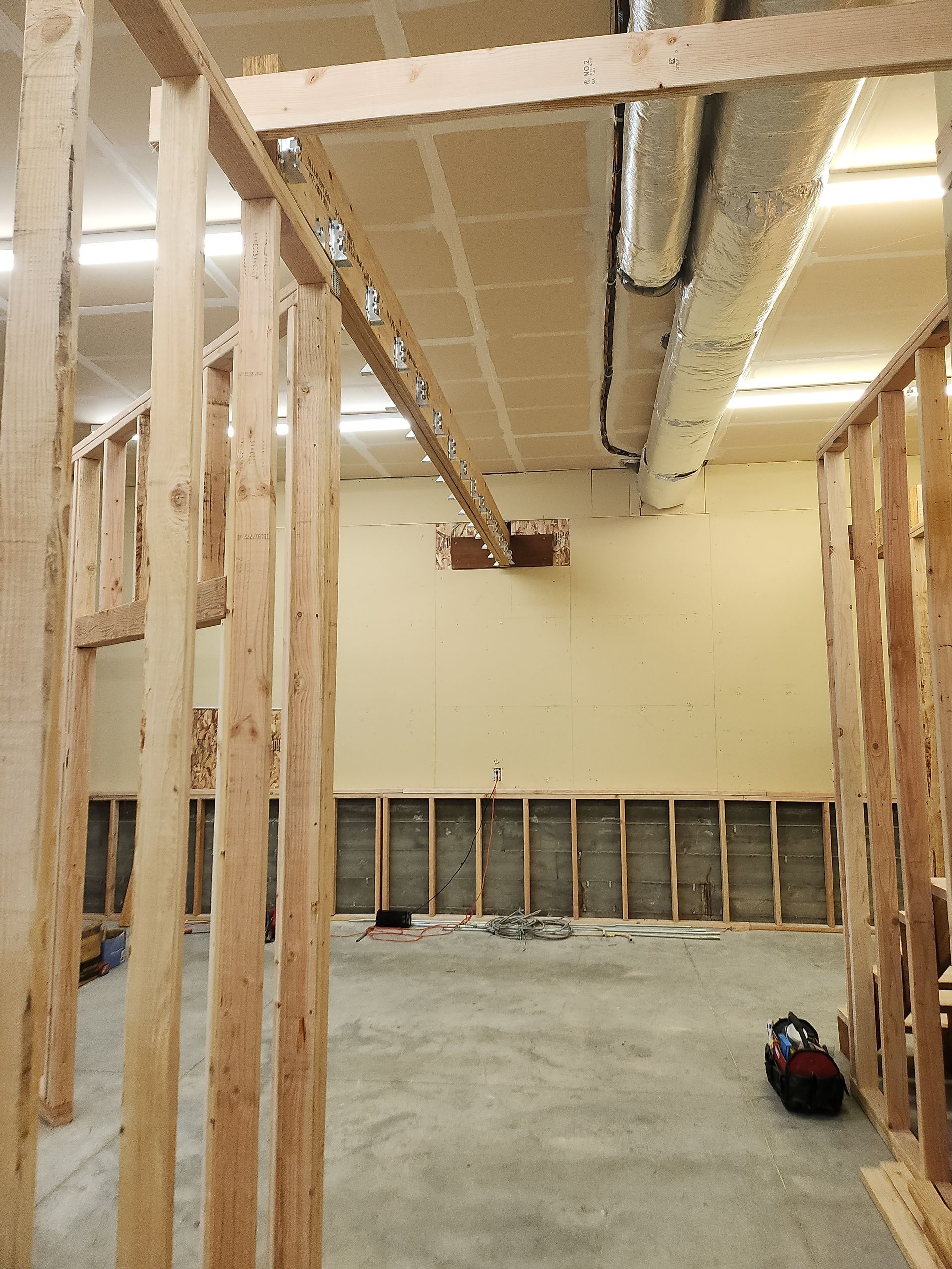 A room that is being built with wooden beams