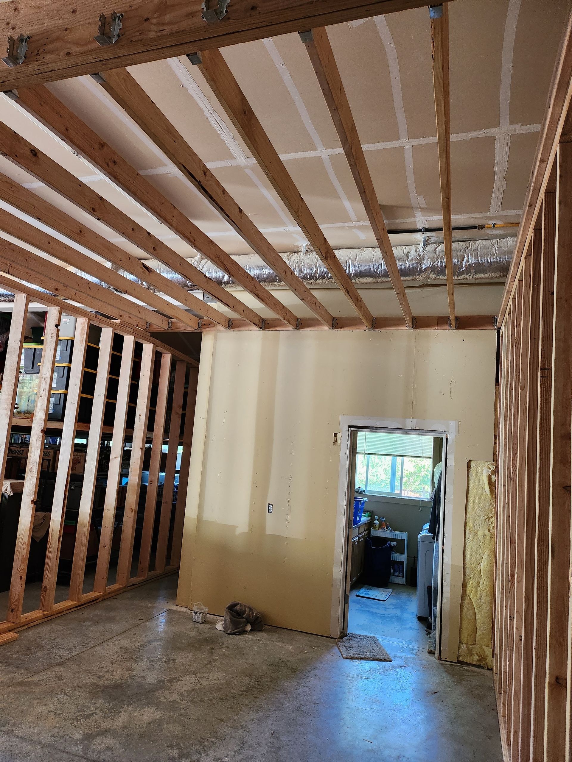 A room that is being built with wooden beams