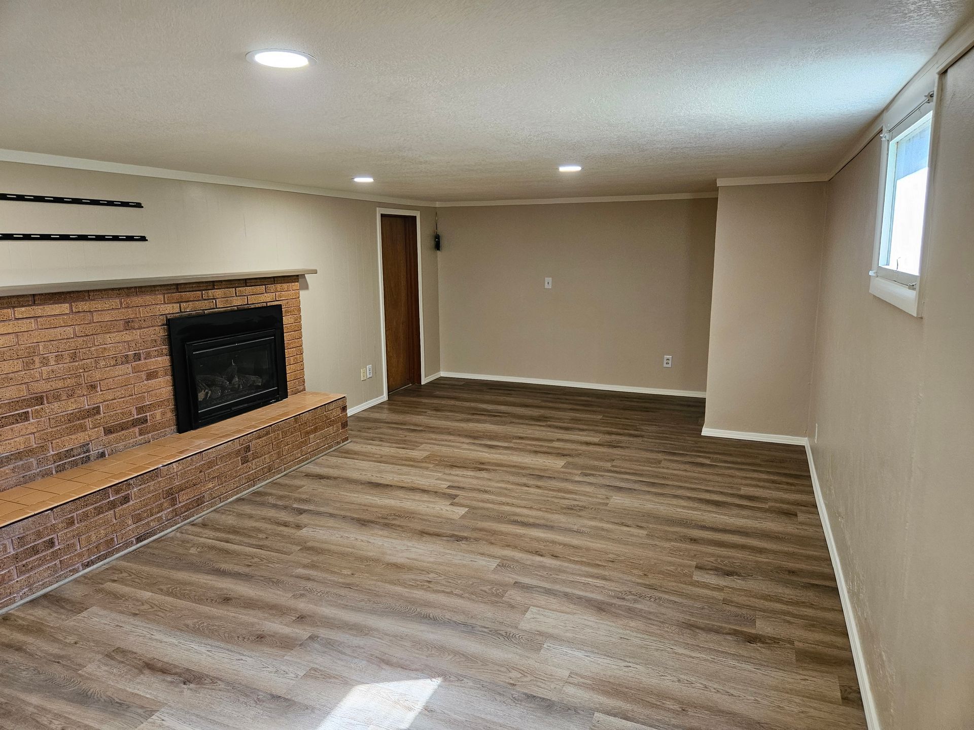 There is a fireplace in the middle of the room.