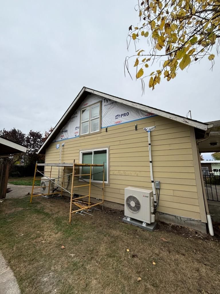 A house with a lot of windows is being remodeled.