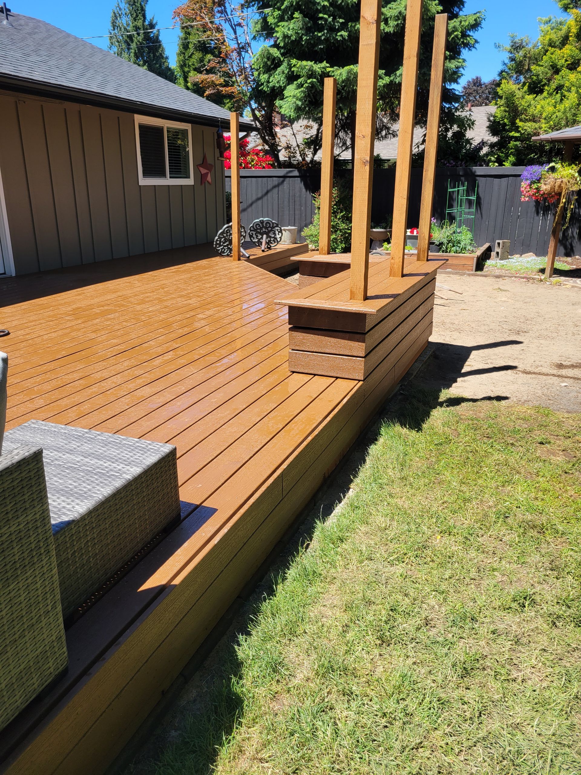A house with a deck and stairs leading up to it.