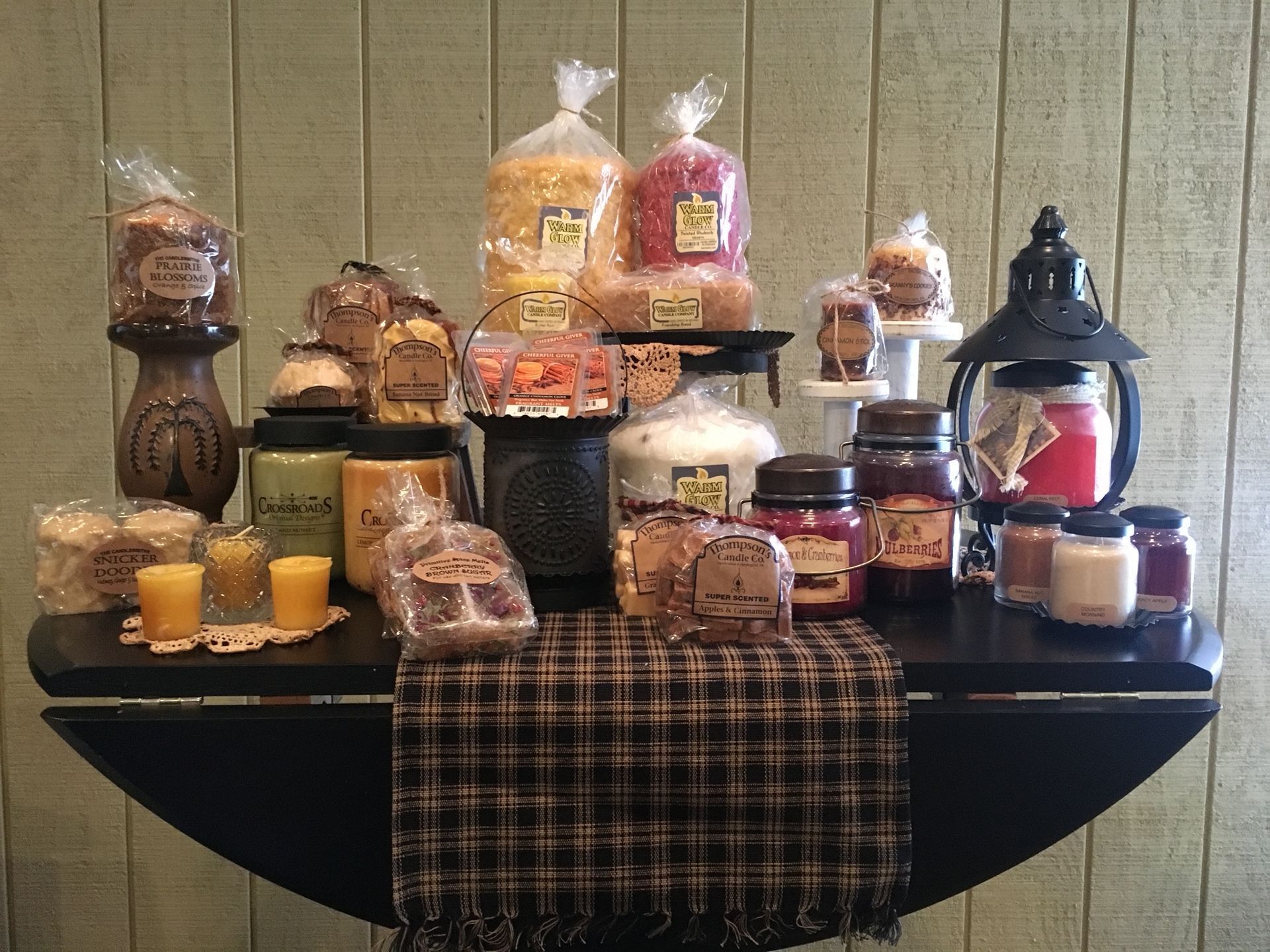 A table with a bunch of food and candles on it