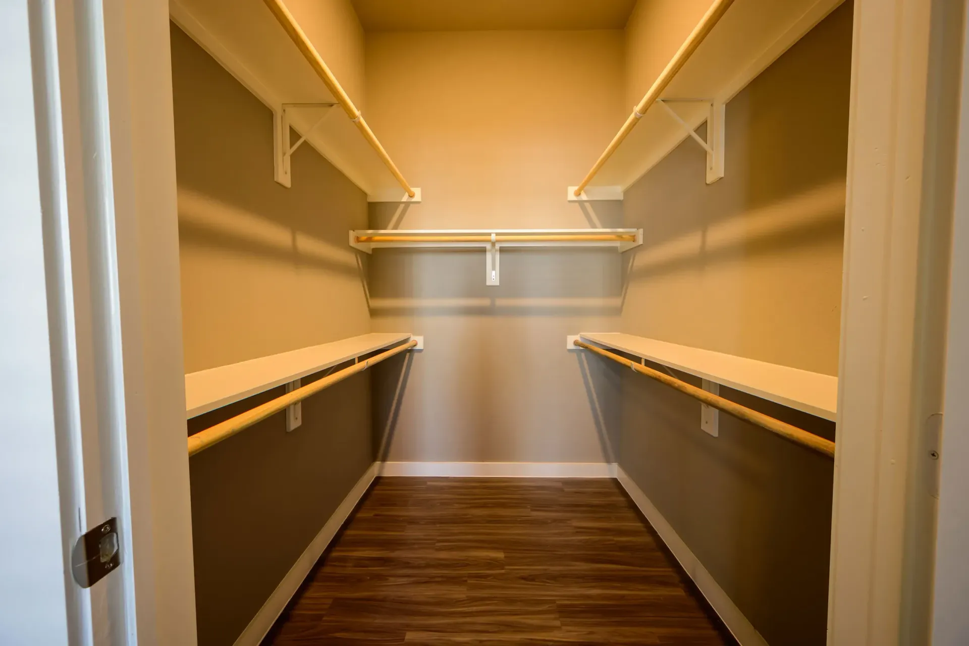 Walk-in closet at Harmony Luxury Apartments in Rowlett, TX.