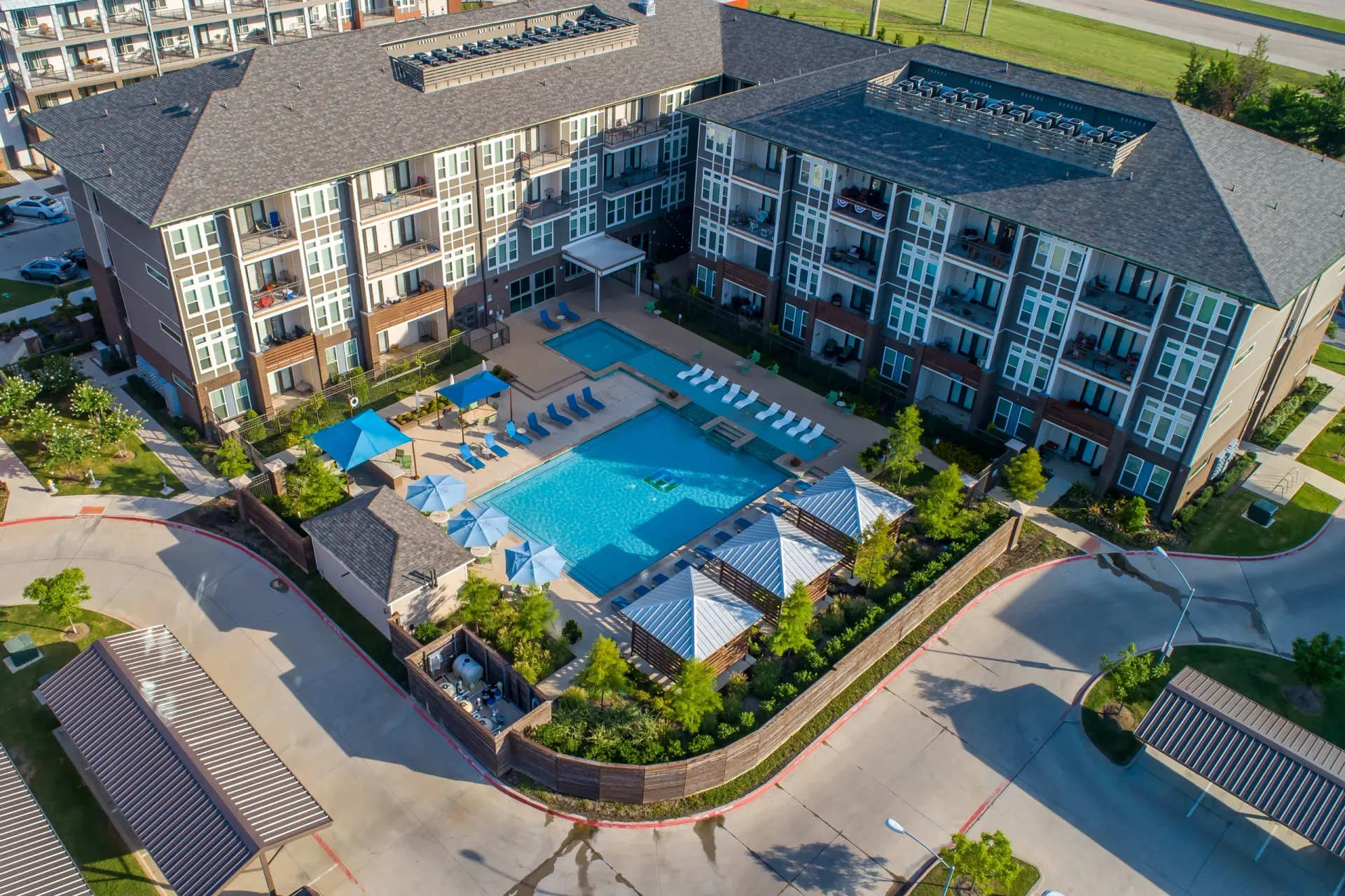 Aerial pool shot at Harmony Luxury Apartments in Rowlett, TX.