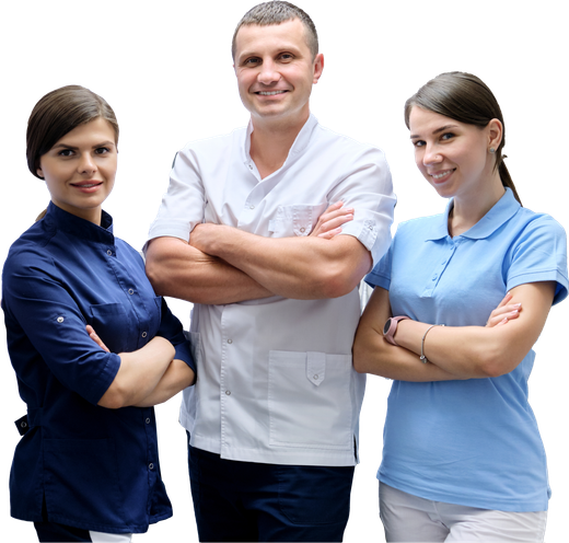 A man and two women standing next to each other with their arms crossed