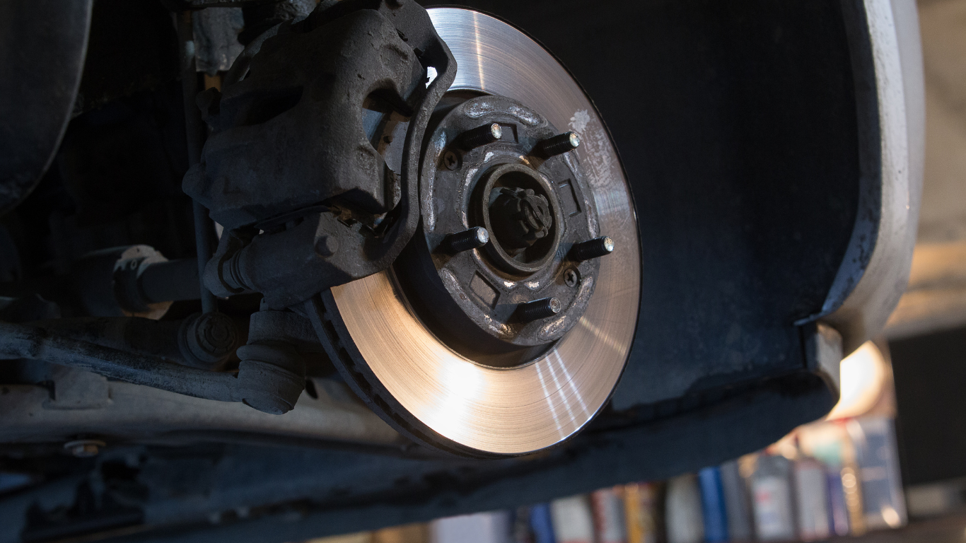 A close up of a brake disc on a car.