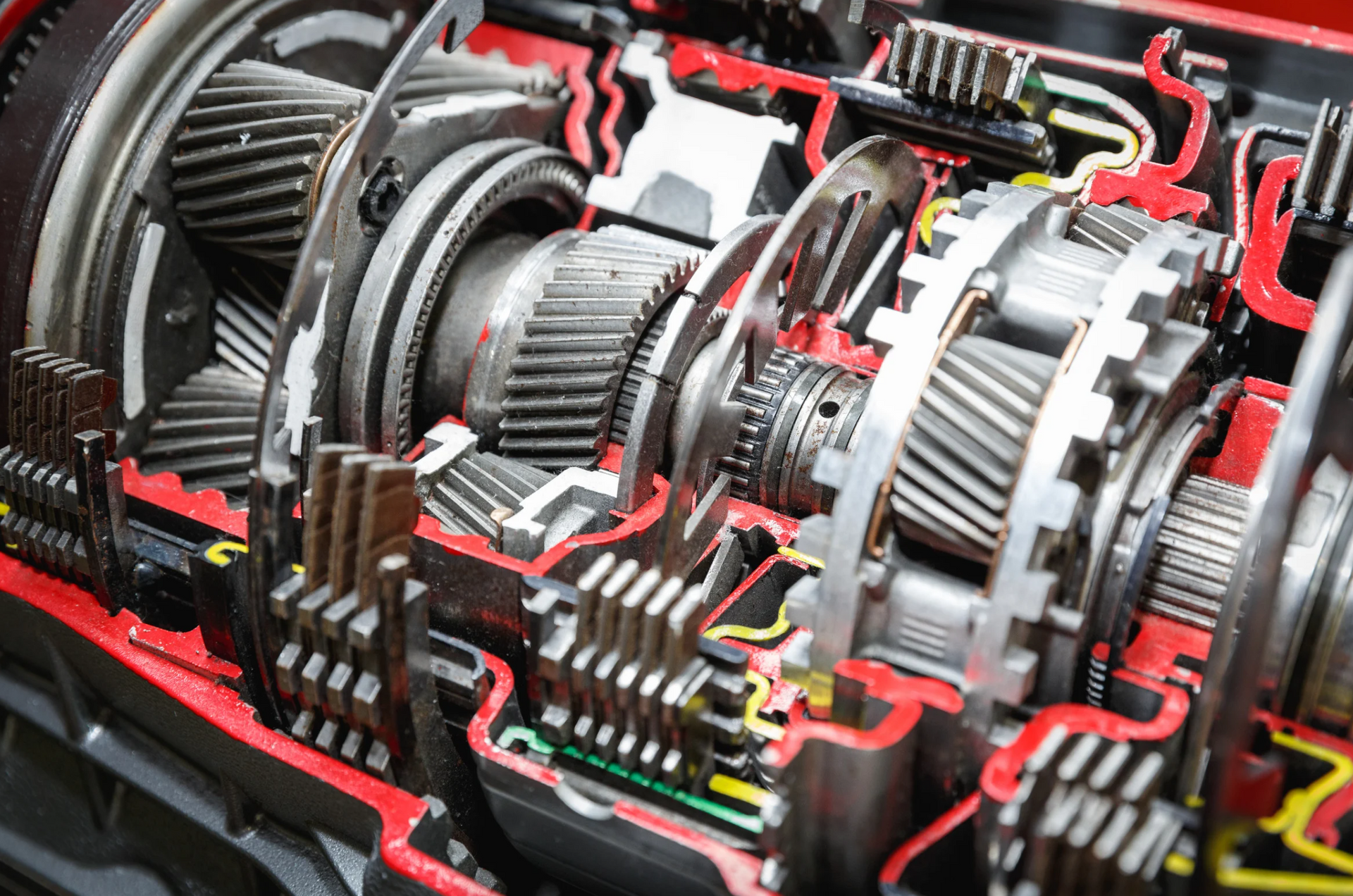 A close up of a cut in half gearbox of a car.
