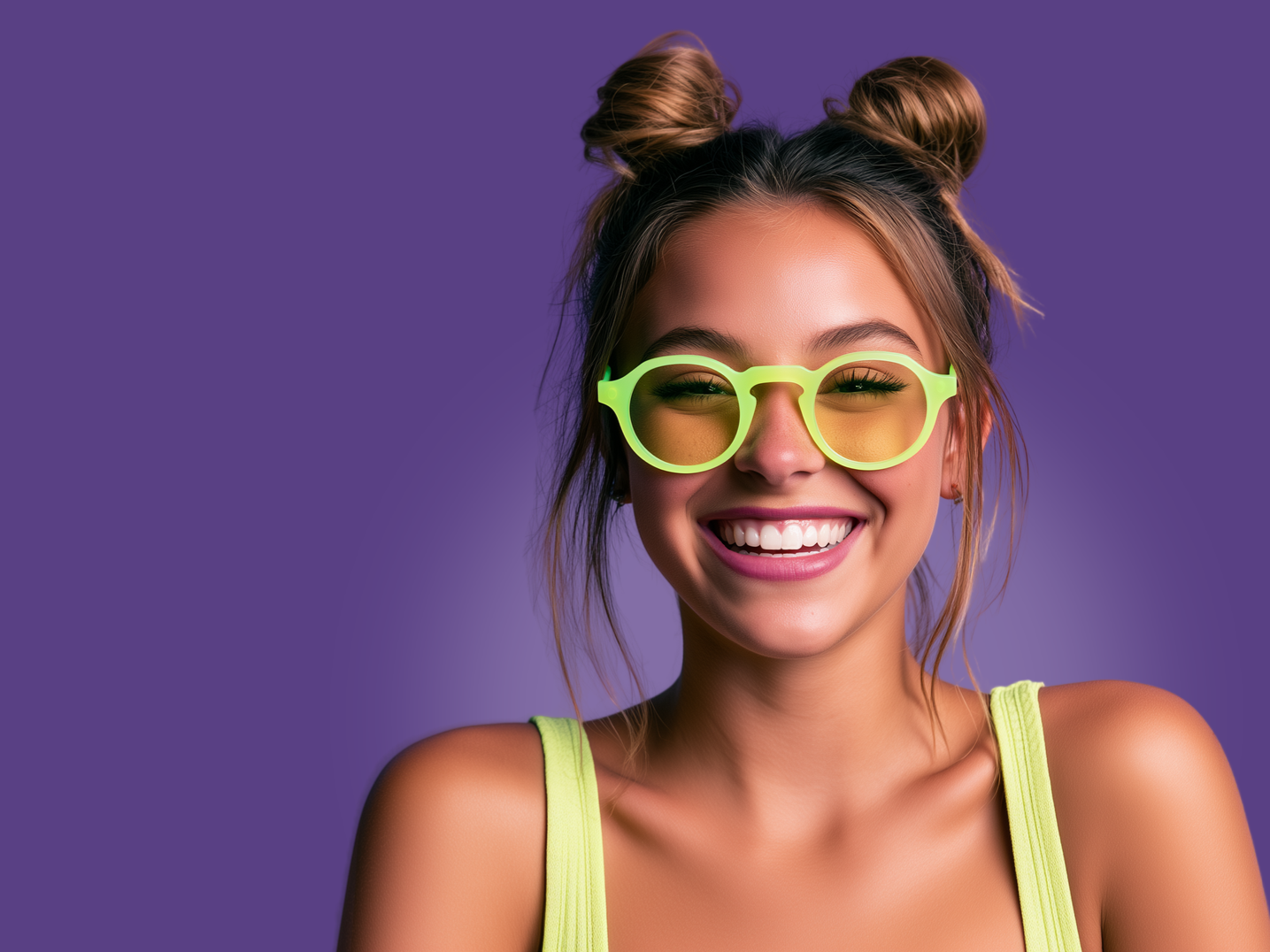 Smiling person with neon green glasses and top against a purple background