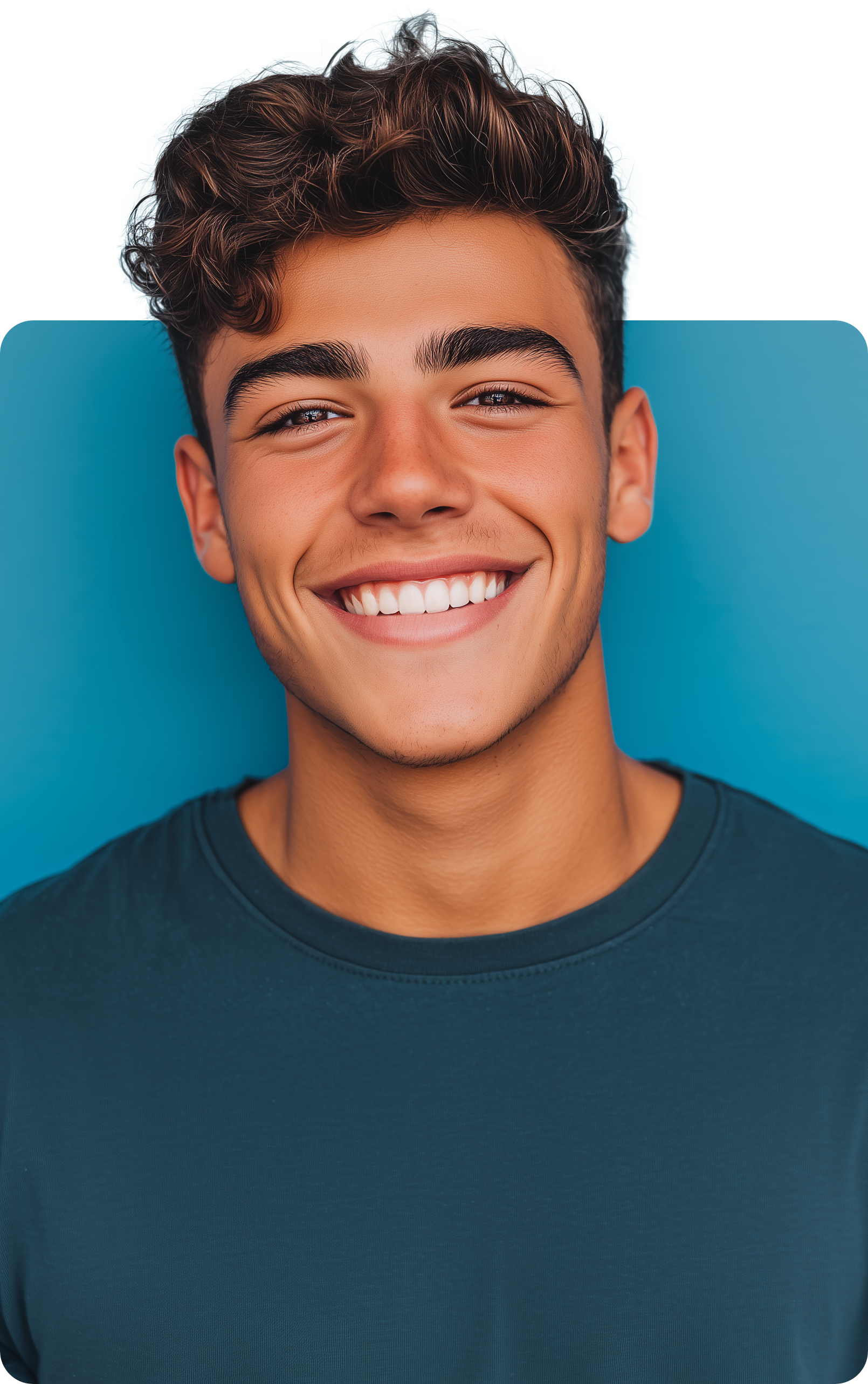Teenager with curly brown hair smiles broadly, against a blue background.