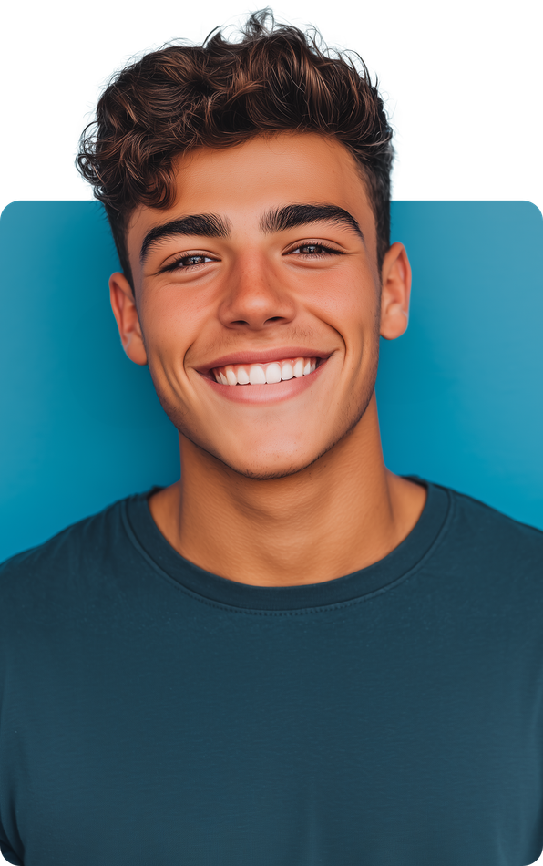 Teenager with curly brown hair smiles broadly, against a blue background.