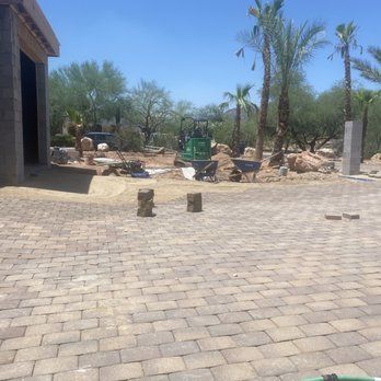 Retaining wall and paver walkway installed by Arizona masonry team