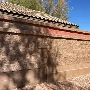 Decorative block retaining wall with paver edging in Arizona