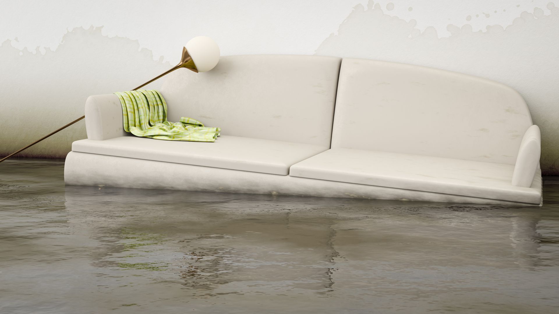 A white couch is sitting in a flooded room next to a lamp.
