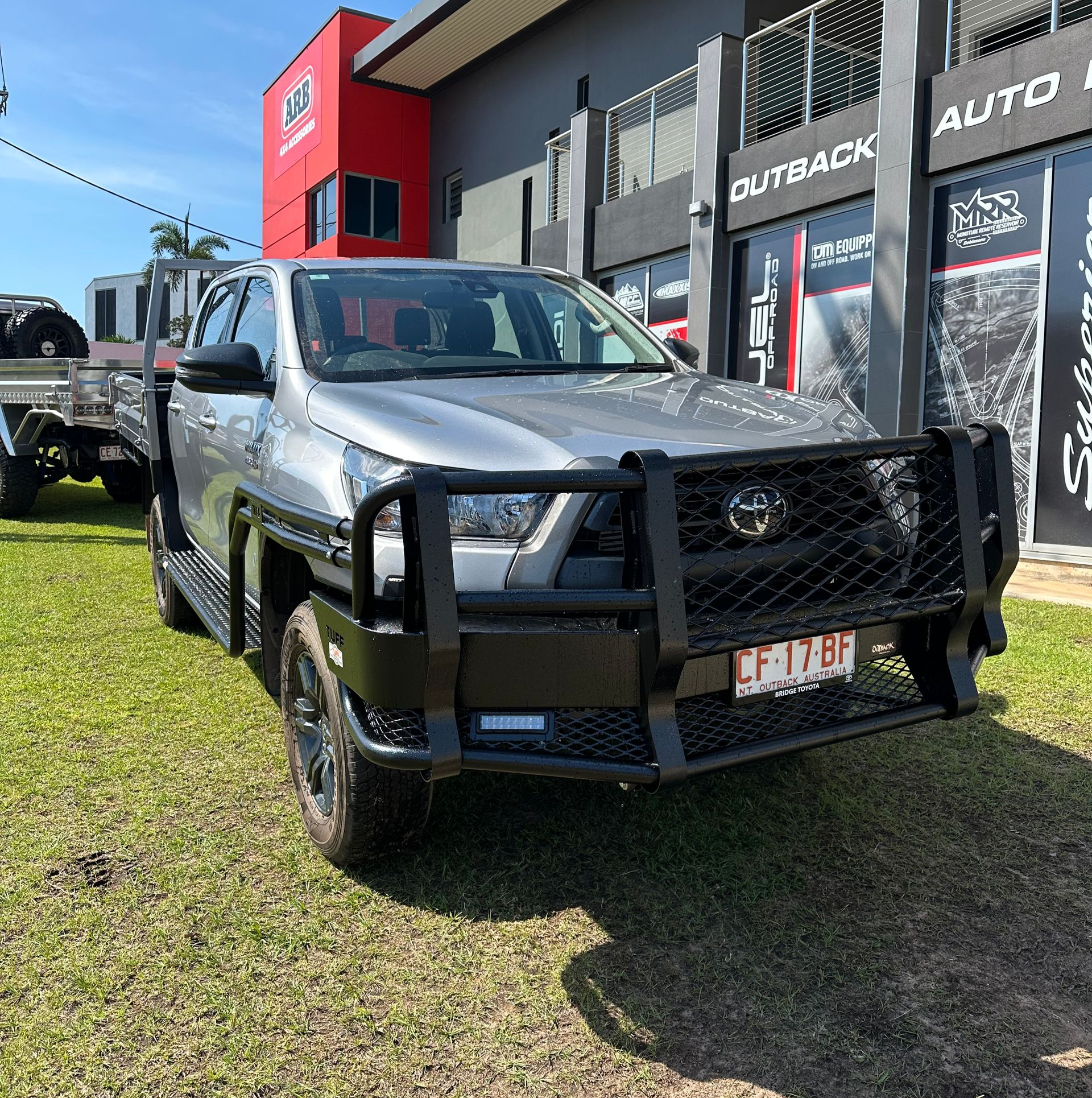 Silver pickup truck with a black grille guard parked outside an auto shop. — Outback Auto NT in Berrimah, NT