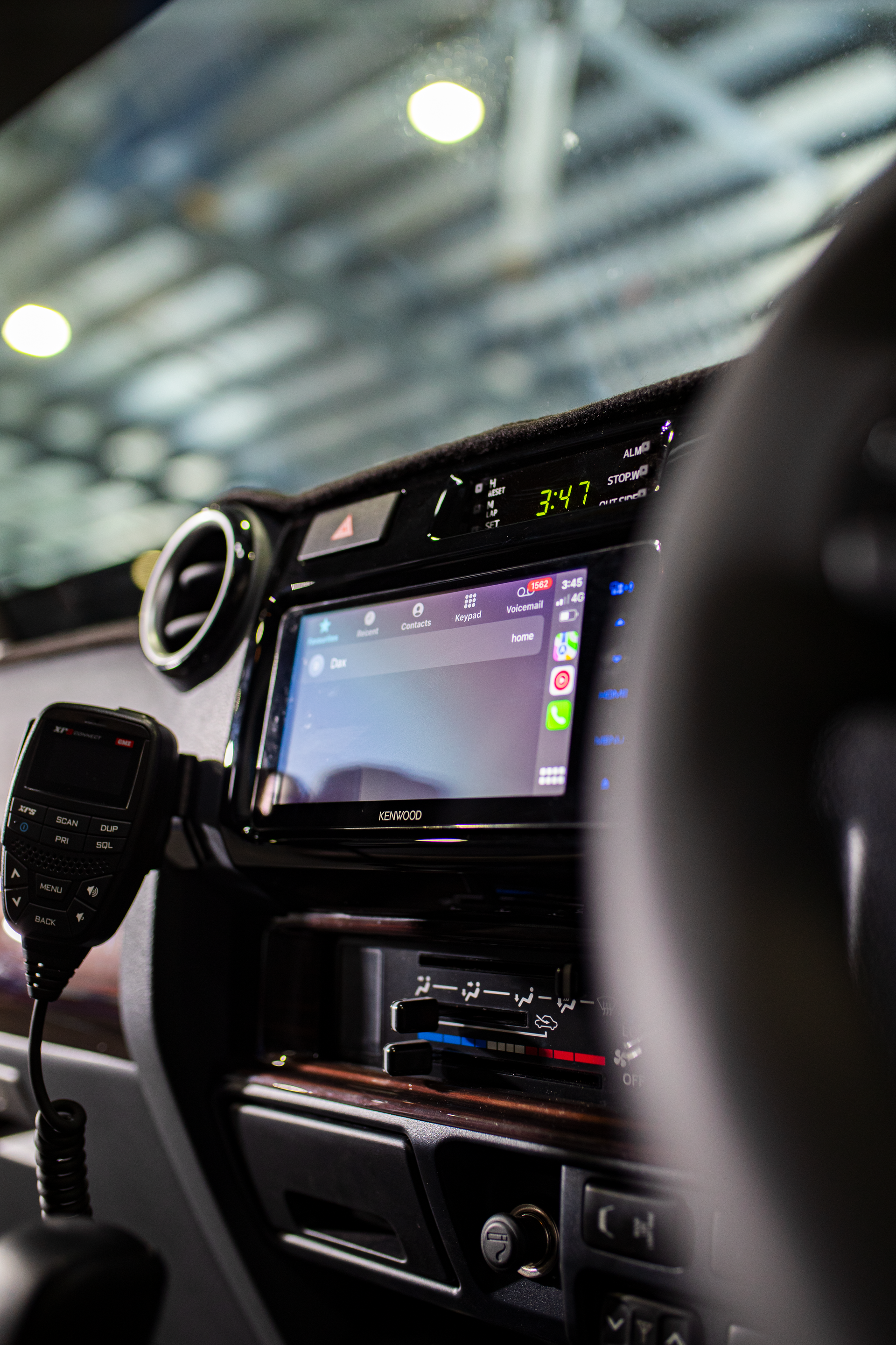 Car dashboard with central touchscreen and controls, viewed from the driver’s seat inside a vehicle. — Outback Auto NT in Berrimah, NT