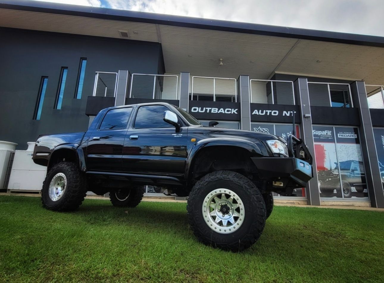 Lifted Pickup Truck Parked on a Green Lawn — Outback Auto NT in Berrimah, NT