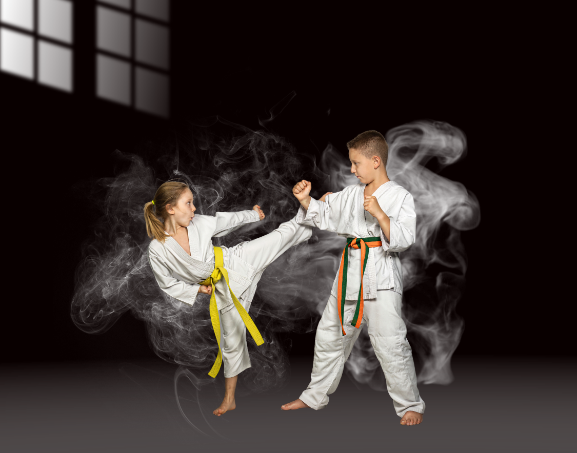A boy and a girl are practicing karate in a dark room.