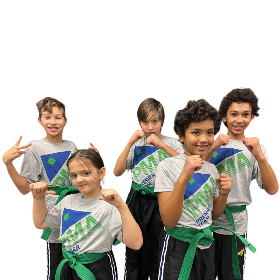 A boy and two girls are wearing karate uniforms and pointing at the camera