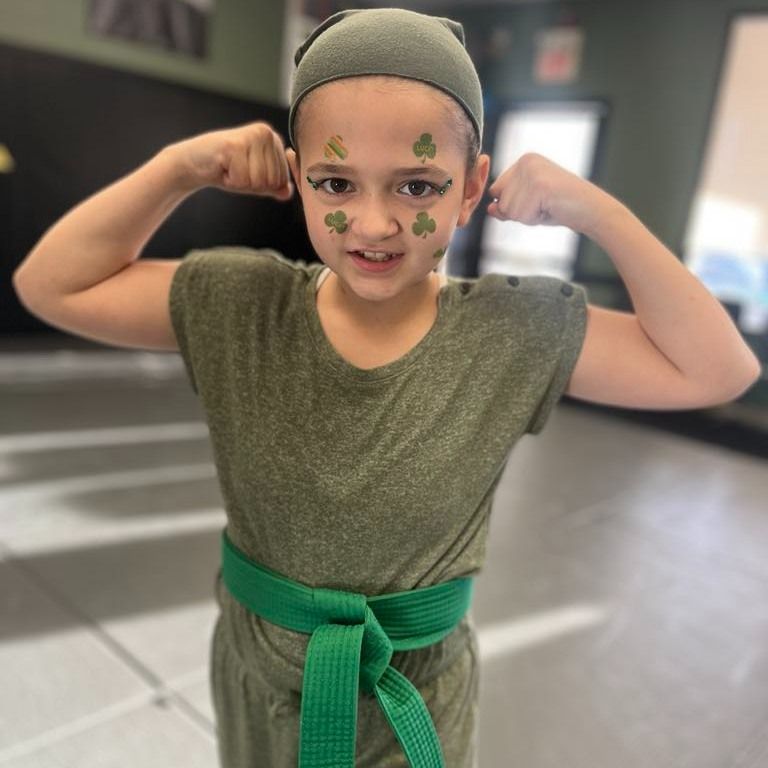 An aerial view of a city skyline at sunset.