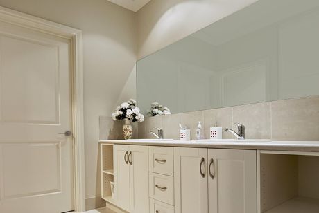 a bathroom with a double sink and a large mirror