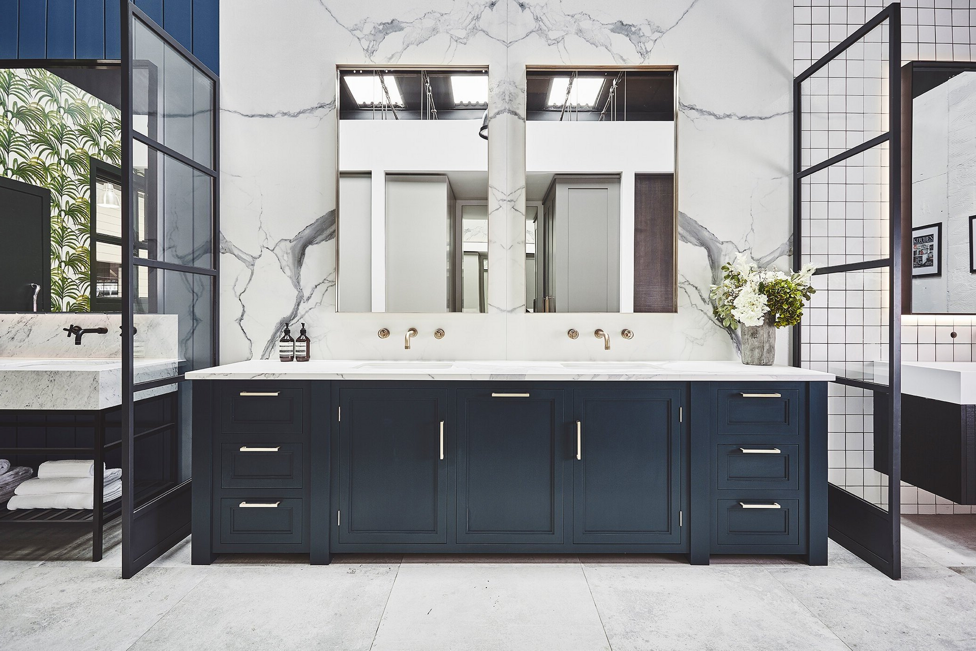 A bathroom with two sinks and two mirrors.